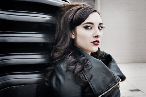 closeup portrait of senior girl in a black leather jacket and red lips