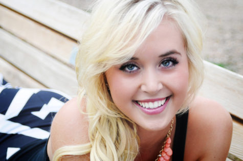 close up of high school senior girl smiling with blonde hair