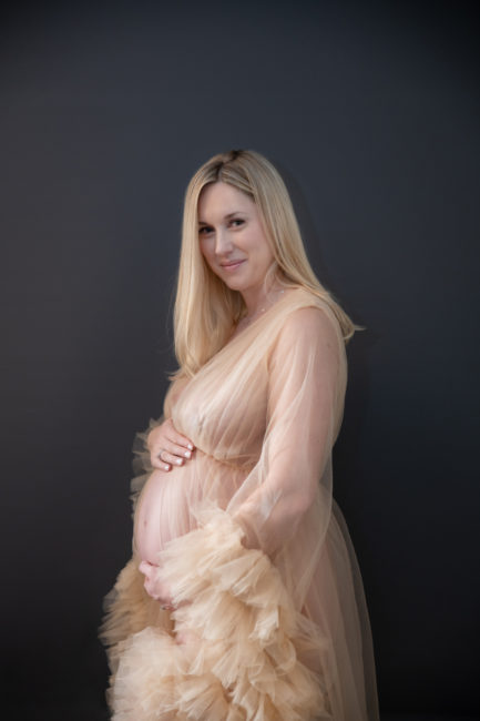denver maternity and newborn portrait of mother in a soft ruffled dress