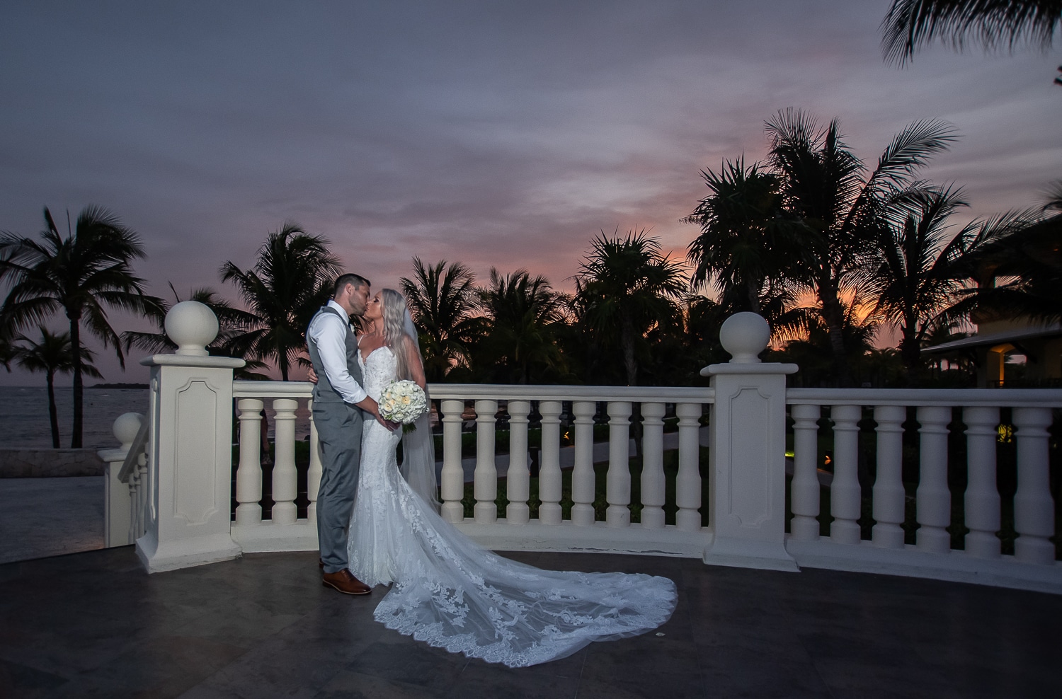 bride and groom at sunset in a tropical setting