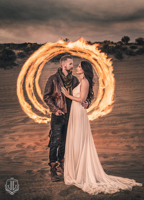 edgy bride and groom framed with fire